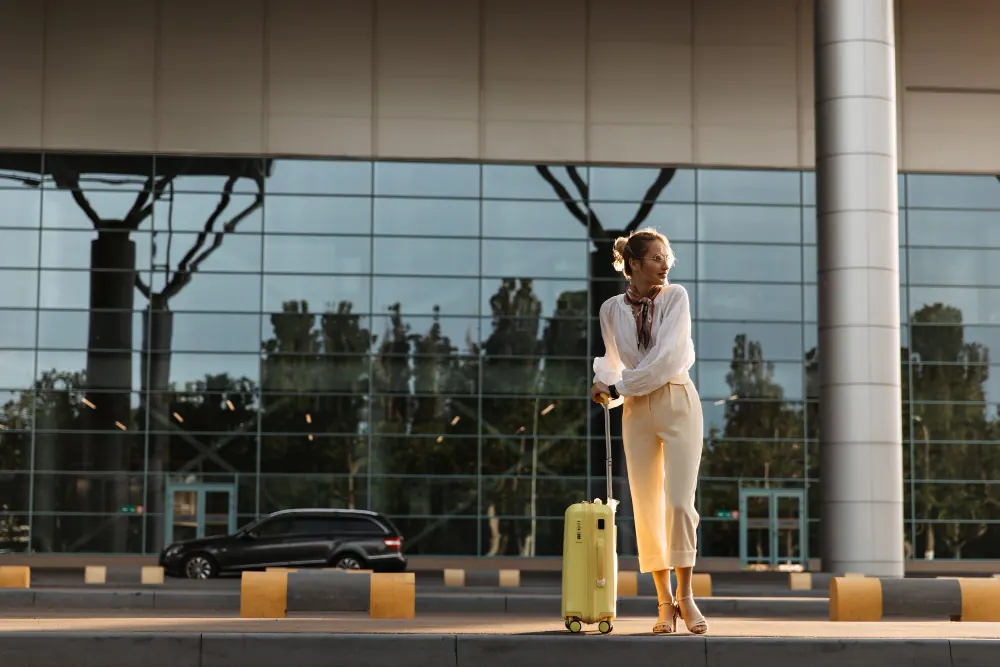 Traveller with luggage at an airport terminal